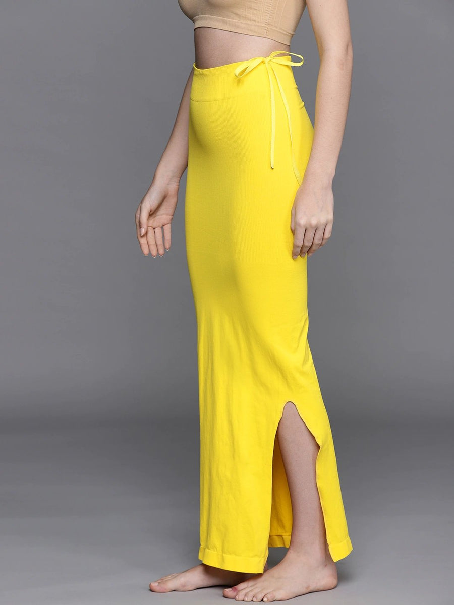 http://www.inddus.in/cdn/shop/products/women-yellow-solid-saree-shapewear-953019_1200x1200.jpg?v=1647171613