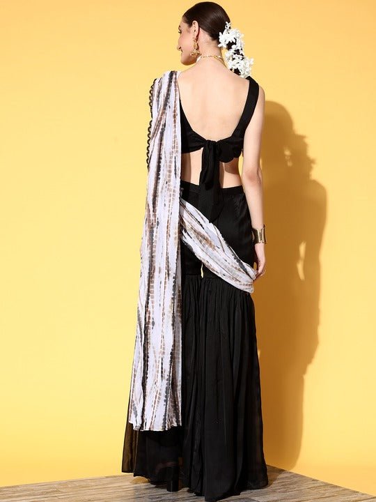 Simple and elegant saree look | Black saree designs, Elegant saree, Saree  wearing styles