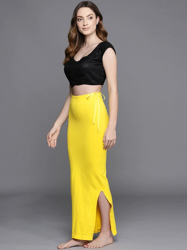 https://www.inddus.in/cdn/shop/products/women-yellow-solid-saree-shapewear-652089_650x.jpg?v=1647171613